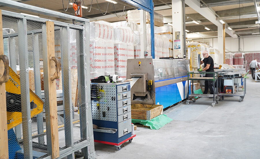 Prodatek staff working on the prefabricated panels produced by the Howick FRAMA™ 5600 machine in their factory in Odense, Denmark.